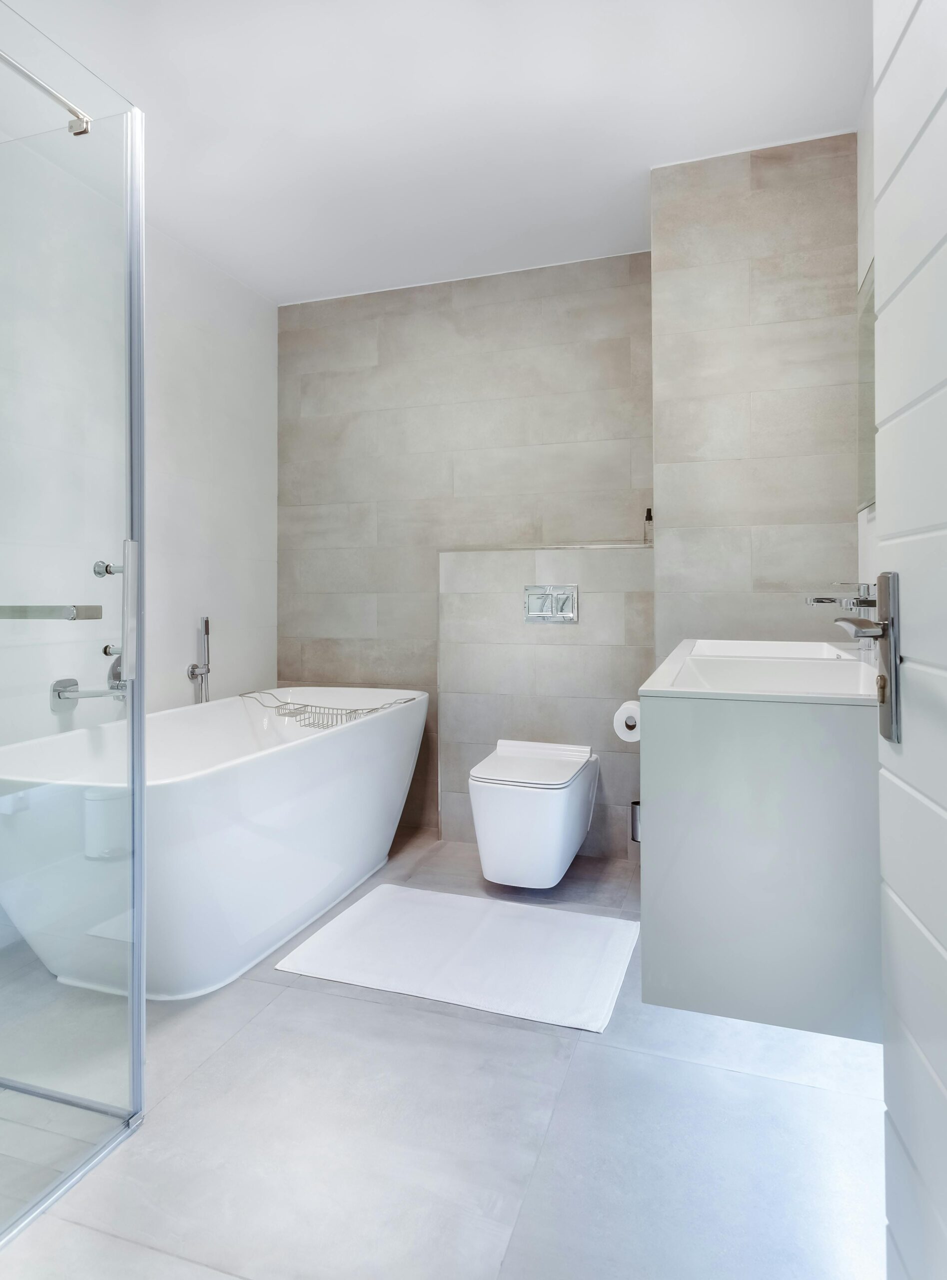 services-02 Elegant minimalistic bathroom featuring bathtub and sleek fixtures.